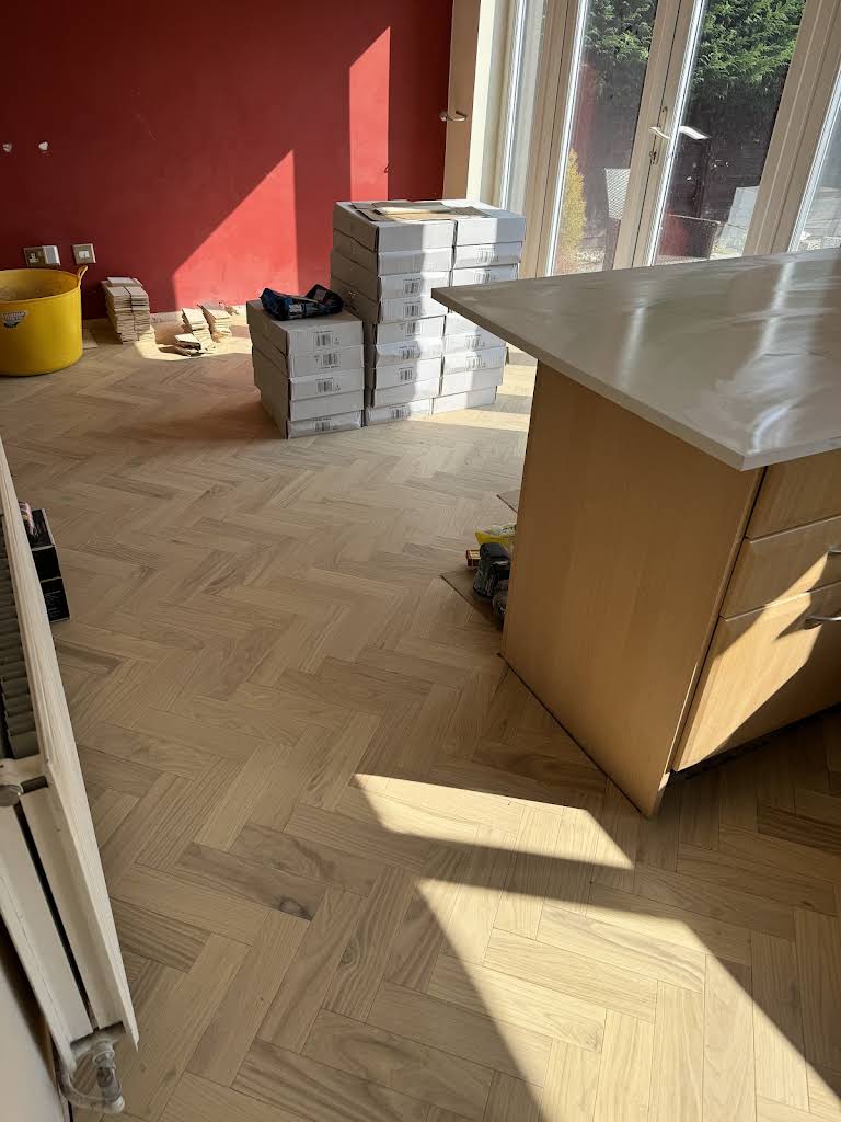 Herringbone engineered wood flooring installed by JCL Renovations